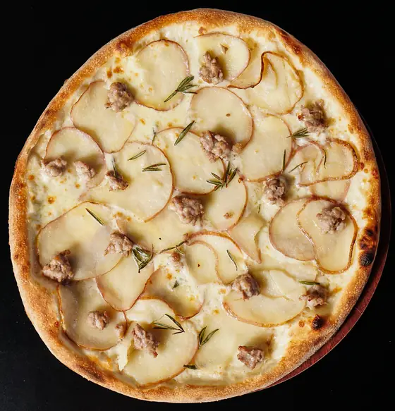 Potato and Sausage pizza from above, with rosemary