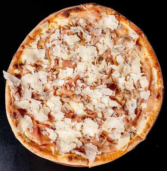 Trufflemen pizza from above: prosciutto and shaved parmigiano over mushroom